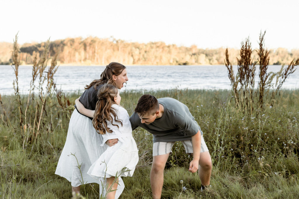 fun and natural family photoshoot session by the lake
