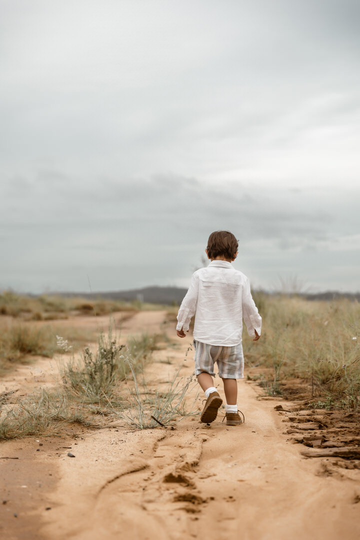 Rainy Day photography - son walking down dirt road