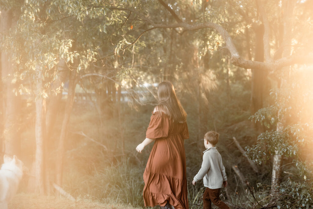 Winter glow around Mum and Son as they walk away from the camera.